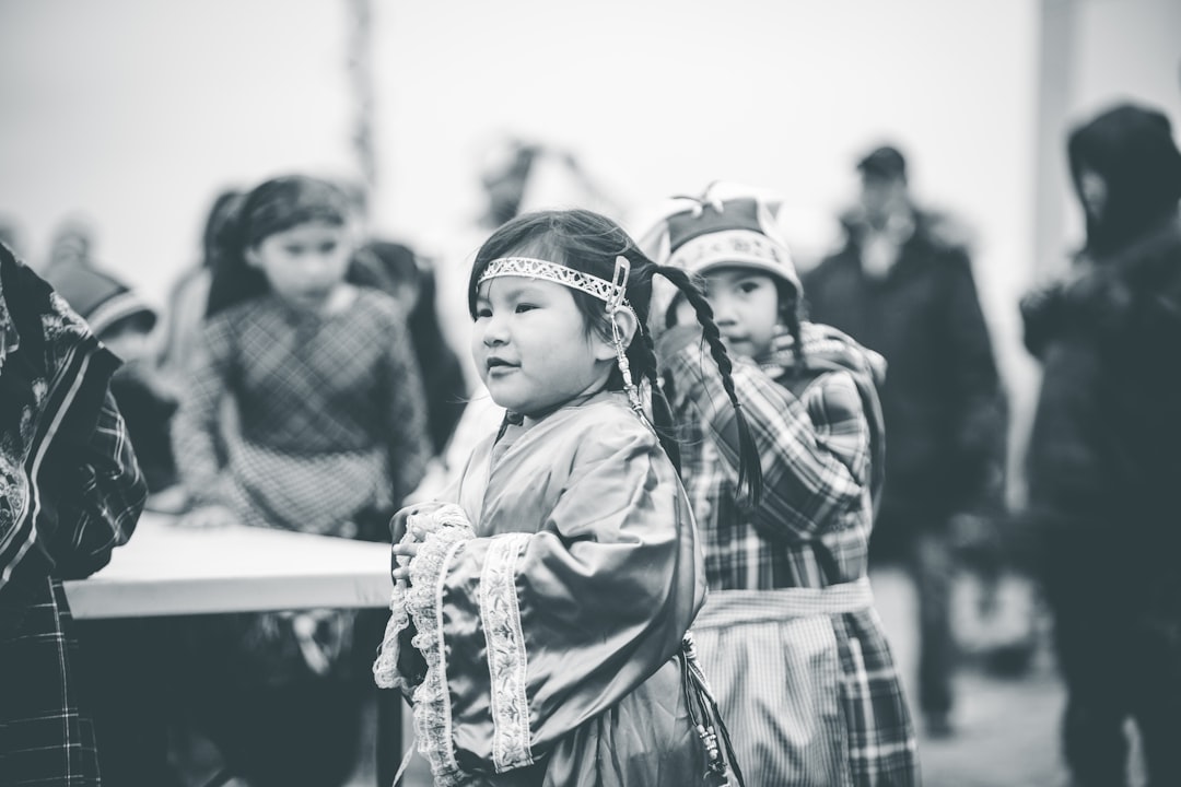 a group of young children standing next to each other